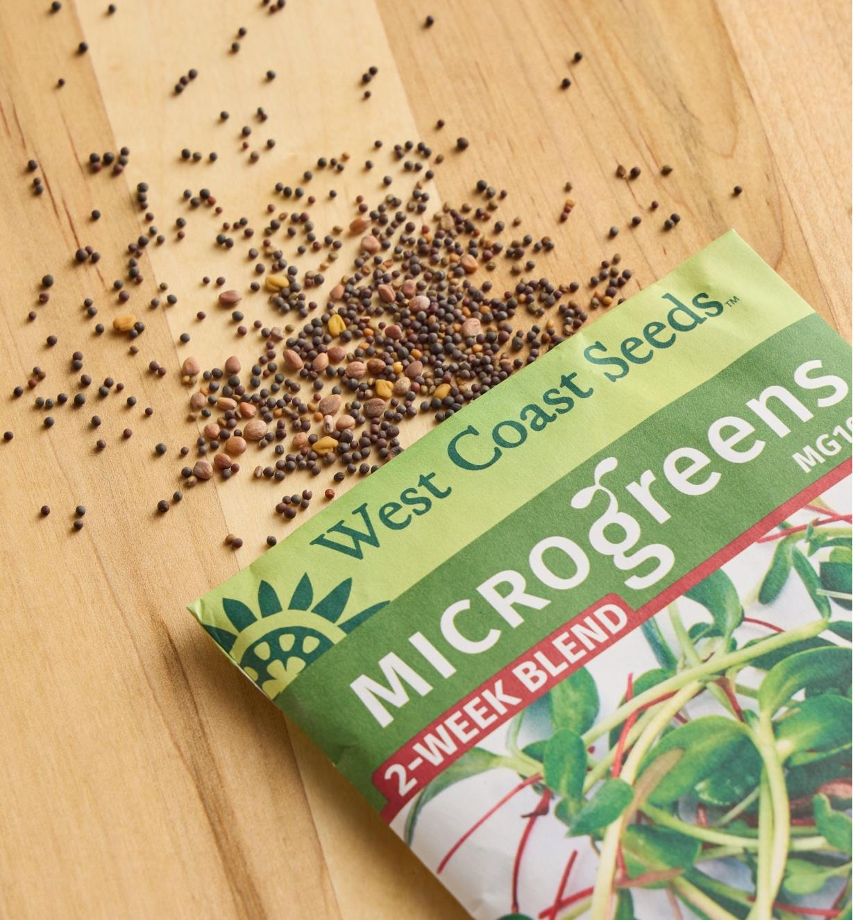 Two-week blend microgreen seeds scattered on a wood surface