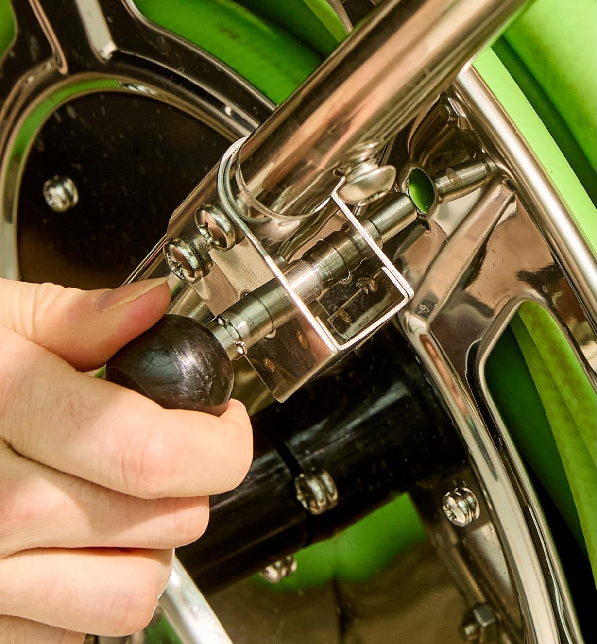 Using the brake on the stainless-steel hose reel cart